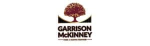 Garrison McKinney logo with tree design.